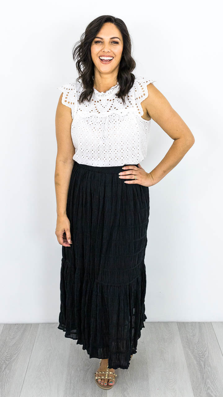 The Earl Skirt, easy to wear with an elastic waistband, tiers through the body and lined. The skirt has a textured material with a slight stretch. Sizes available  XS to XL. This skirt is true to size. 